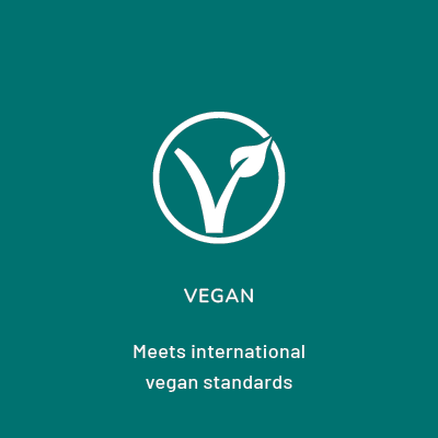 Within the circle is the letter V with a plant sprouting out of the top right corner of the V. Beneath the circle the words read: VEGAN. Meets international vegan standards.