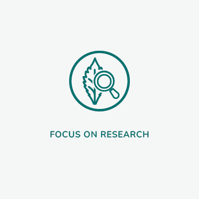 A square image with a white circular icon depicting a magnifying glass over a leaf, symbolizing Linnea's commitment to research and development of innovative extracts. The text highlights the passion of their scientists in finding treatments to improve lives.